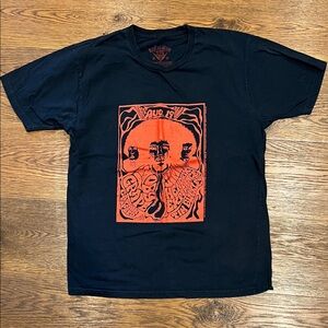 Vintage Black Graphic Tee with Orange Design